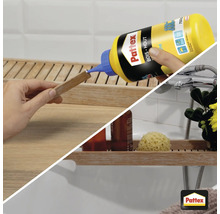Pattex houtlijm aanbrengen op een stuk hout in de badkamer