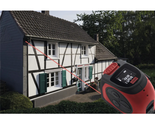 Laser afstandsmeter in gebruik voor een huis om afstanden te meten