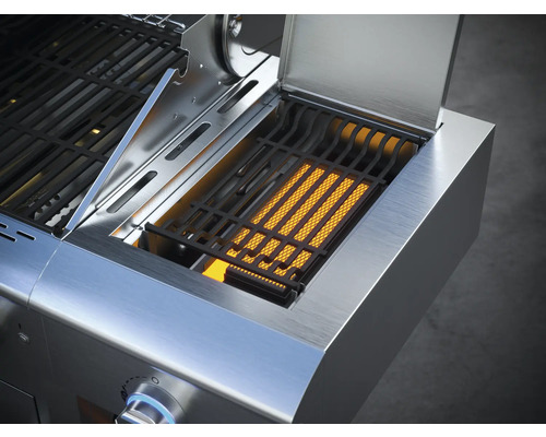 Detailweergave van een roestvrijstalen barbecue met open zijbrander