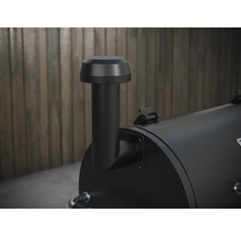 Detailopname van de luchtafvoerkanaal van een zwarte smoker