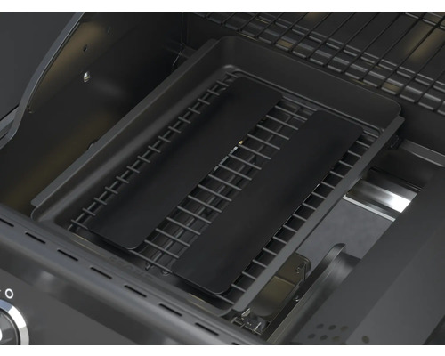 Binnenaanzicht van een gasbarbecue met grillrooster en afdekplaten