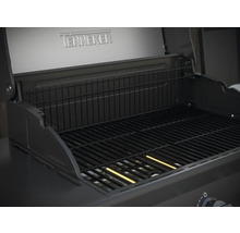 Binnenaanzicht van een Tenneker barbecue met grillrooster en warmhoudrek