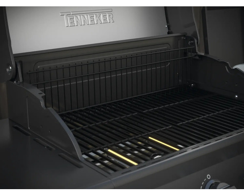 Binnenaanzicht van een Tenneker barbecue met grillrooster en warmhoudrek