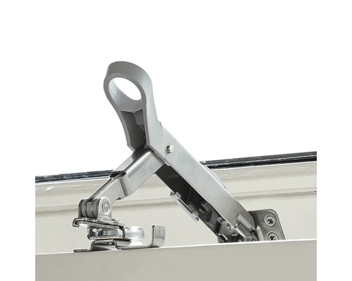 Metalen raamvastzetter gemonteerd op het raamkozijn