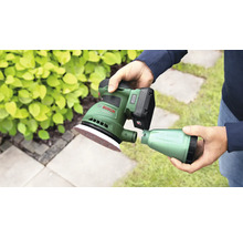 Accuschuurmachine met stofreservoir in de hand