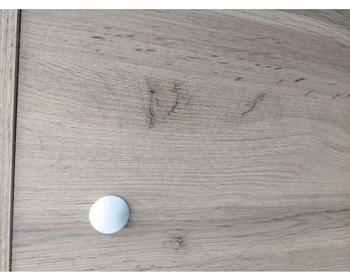 Detailopname van een commode met knopgreep