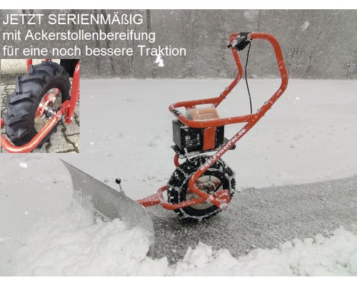 Sneeuwfrees met tractorbanden in gebruik