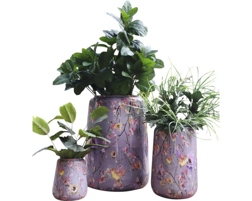 Drie beplante bloempotten met bloemmotief