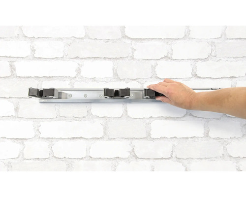 Wandhouder voor stelen met hand