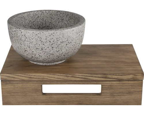 Decoratieve stenen schaal op een houten doos