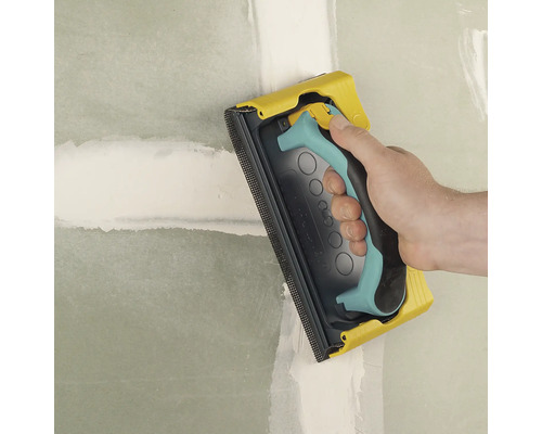 Handschuurmachine gebruikt voor het schuren van een muur.