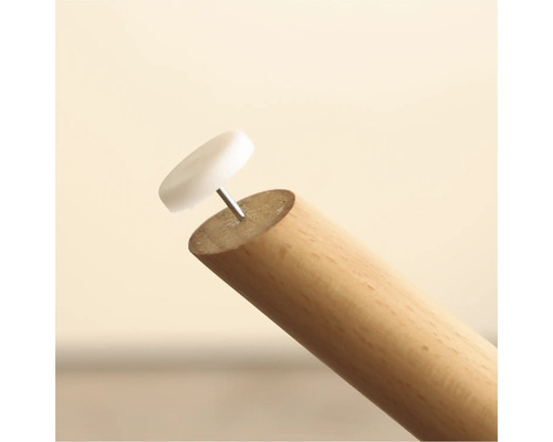Meubelglijder met spijker op een houten poot