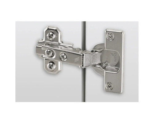 Scharnier met schroeven bevestigd aan een kast