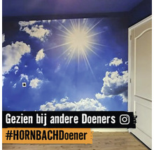 Wanddecoratie met fotobehang met hemelmotief in een kamer