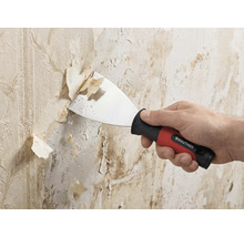 Rautner plamuurmes verwijdert oud behang van de wand. Handmatige spachtel met ergonomische handgreep en metalen blad.