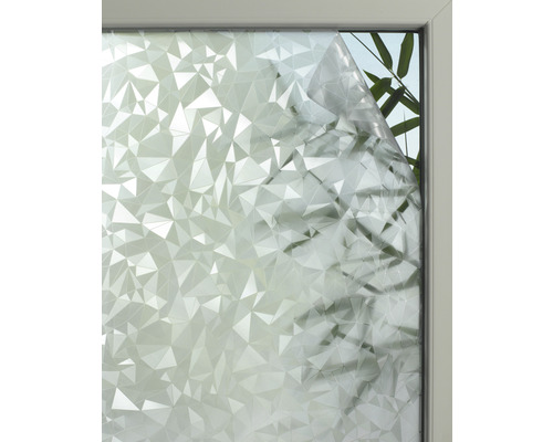 Raam met privacyfolie in geometrisch design.