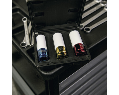 Drie-delige dopsleutelset in een zwarte koffer