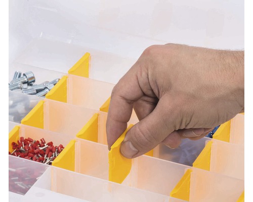 Assortimentsdoos met een hand en diverse kleine onderdelen