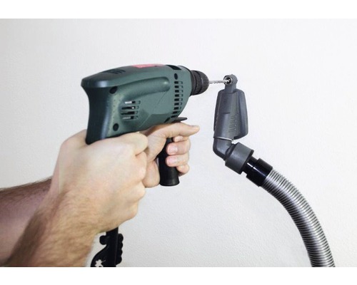 Handboormachine met stofzuiger bevestiging in gebruik