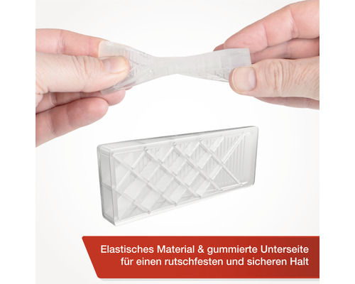 Transparante deurstopper van elastisch materiaal wordt vastgehouden door handen