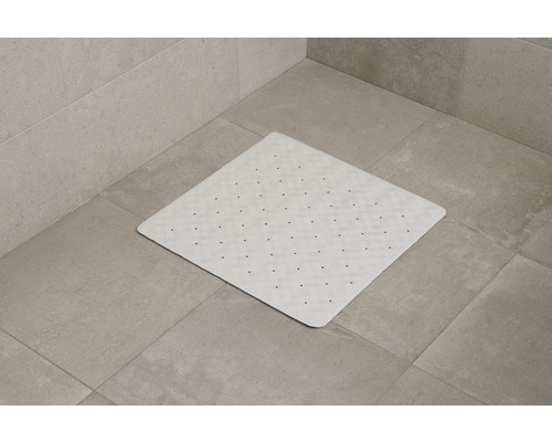 Vierkante douchemat met noppen op tegelvloer