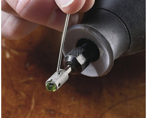 Dremel boor met steenbewerkingshulpstuk en reinigingsnaald