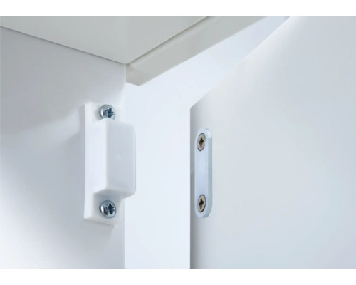 Witte magnetische deursluiting bevestigd aan meubels
