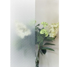 Decoratieve folie met geometrisch patroon naast bloemstuk