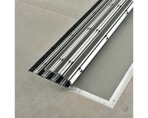 Gedetailleerd beeld van een aluminium inbouwframe met textielmat voor schoonloop