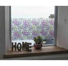 Raam met decoratieve bloemenfolie voor privacy