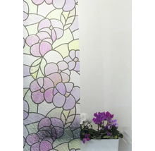 Decoratieve folie met bloemmotief naast een potplant