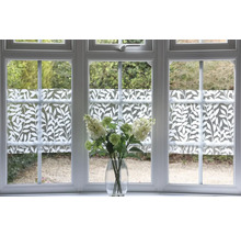 Raam met privacyfolie met plantenpatroon en bloemboeket in vaas