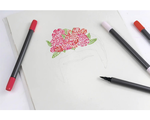 Schetsblok met rozenmotief en pennen