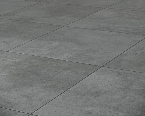 Close-up van grijze vloertegels met een matte afwerking en lineair voegpatroon