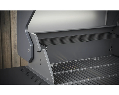 Binnenaanzicht van een gasbarbecue met grillrooster en warmhoudrek.