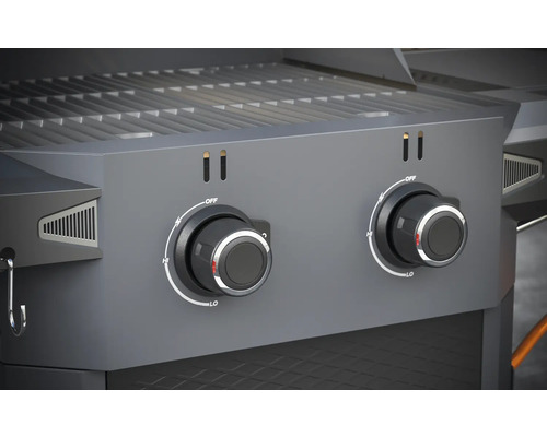 Close-up van een gasbarbecue met twee draaiknoppen voor temperatuurregeling