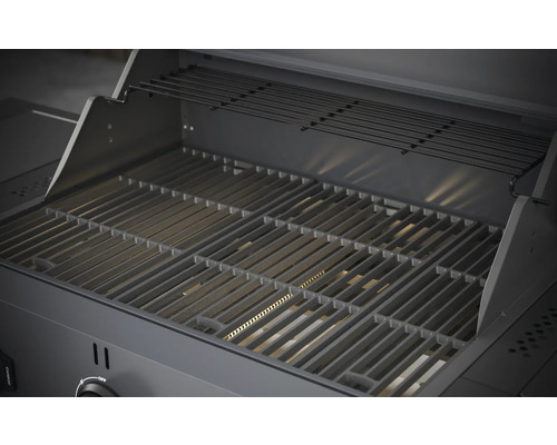 Binnenkant van een gasbarbecue met grillrooster en warmhoudrek.