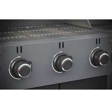 Close-up van een gasbarbecue met drie draaiknoppen voor temperatuurregeling