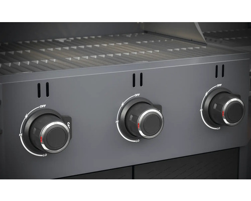 Close-up van een gasbarbecue met drie draaiknoppen voor temperatuurregeling