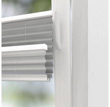 Detailopname van een geplisseerd raam