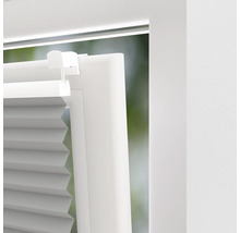 Detailaanzicht van een plisségordijn op een raam