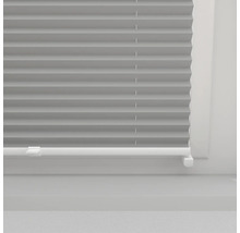 Grijze plisségordijnen op het raam