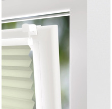 Close-up van een plisségordijn op een raam