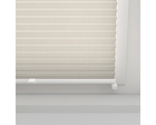 Close-up van een plisségordijn bij het raam