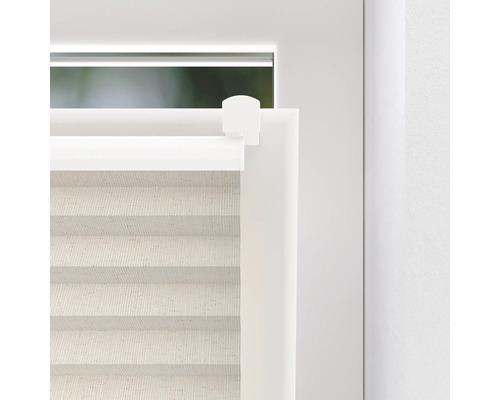 Detailweergave van een plisségordijn op het raam