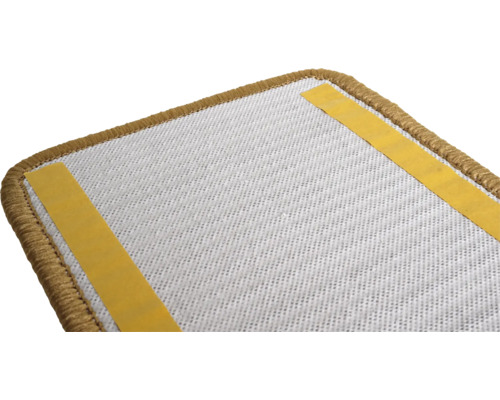 Achterkant van een trapmat met plakstrips