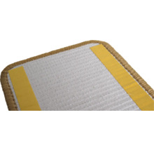 Achterkant van een tapijttegel met plakstrips