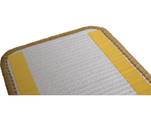 Achterkant van een tapijttegel met plakstrips