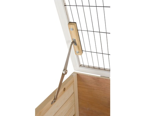 Detailopname van een geopend klein dierenverblijf met rasterafdekking en scharnier