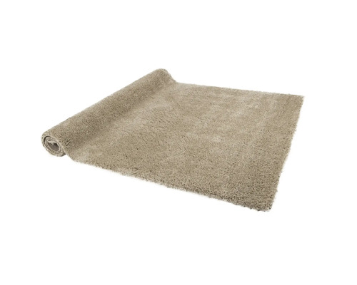 Opgerolde, lichte hoogpolige vloerkleed